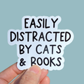 Easily distracted by cats and books sticker